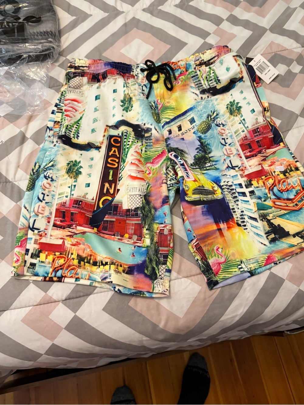 Good Vibes Men's Multicolor Graphic Swim Trunks - Vibrant Casino Print